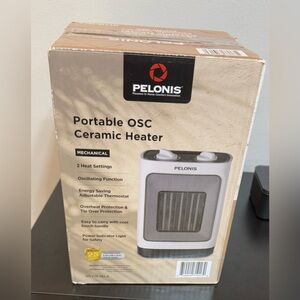 Portable Ceramic Heater - Black and White 2 Heat Setting . Intensity:1500 W